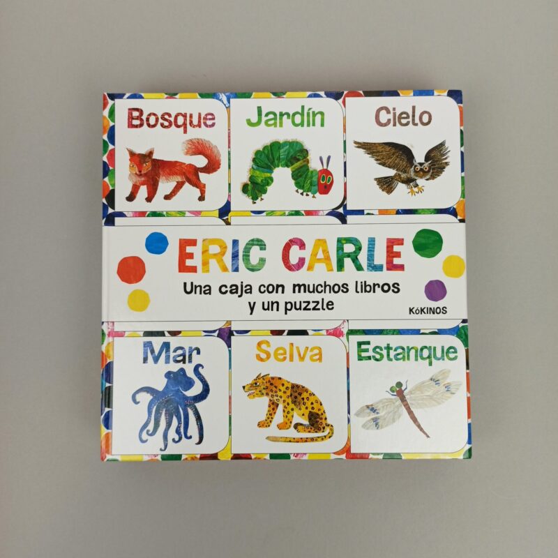 Una caja con muchos libros y un puzzle